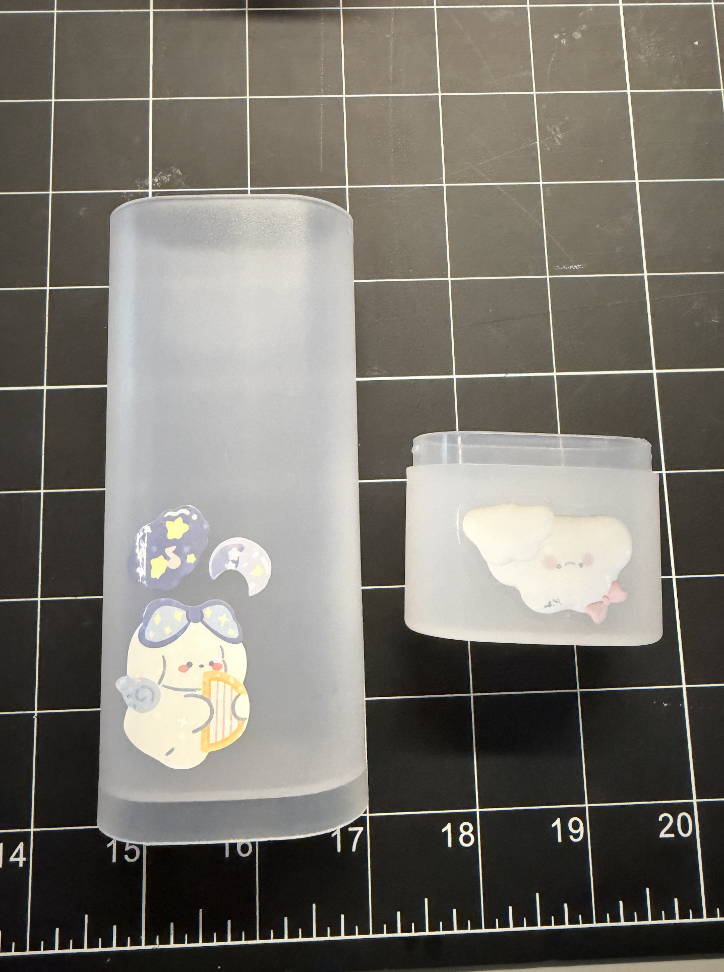 Frosted pen case with the cap off, front-facing.