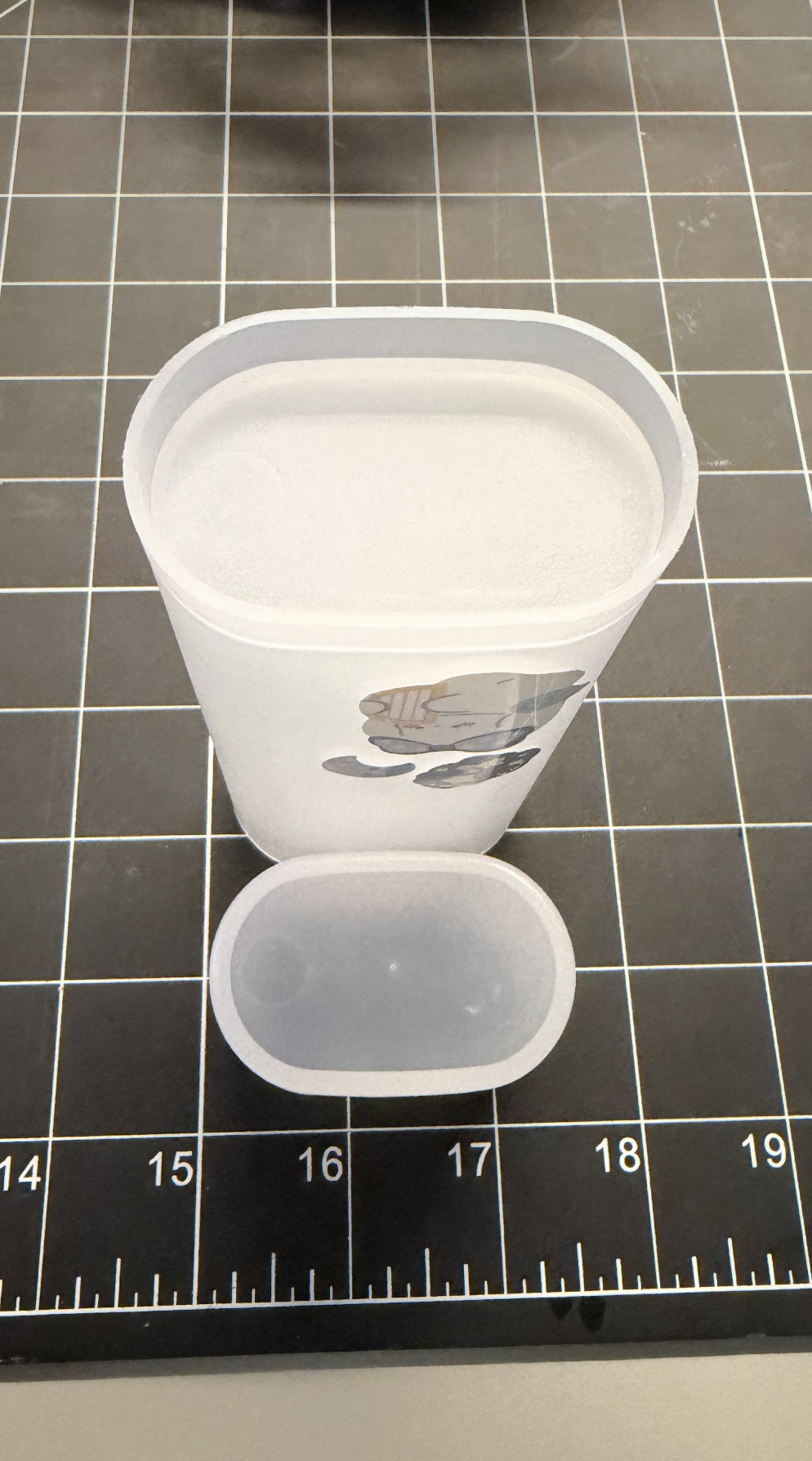 Frosted pen case with the cap off, diagonal view.